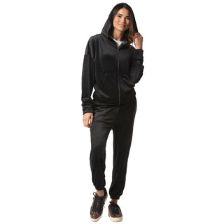 Woman wearing a black velvet zip-up hoodie fully zipped up with hood on and white crew new tshirt underneath and matching pants on a white background
